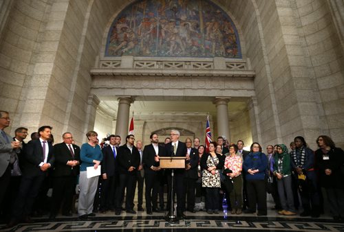 Premier Greg Selinger announces plans to welcome Syrian refugees to the province along with MLAs and members of refugee settlement organizations in the Manitoba Legislative building Thursday. Carol Sanders story  Wayne Glowacki / Winnipeg Free Press Nov. 26    2015