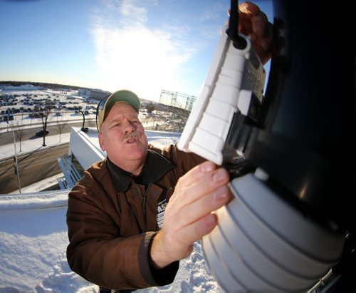 Guy Ash checks on one of his weather stations at Investors Group Field prior to Sundays Grey Cup, Thursday, November 26, 2015. (TREVOR HAGAN/WINNIPEG FREE PRESS)