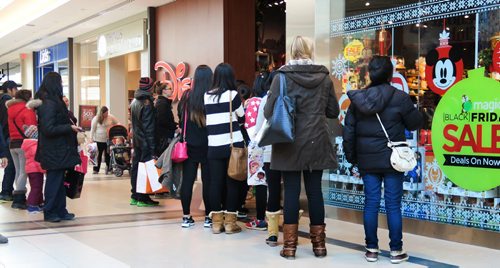 People wait in line outside the Disney store to take advantage of Black Friday deals at Polo Park Shopping Centre Friday morning.   Standup pic Nov 27, 2015 Ruth Bonneville / Winnipeg Free Press