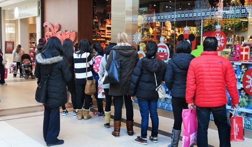 People wait in line outside the Disney store to take advantage of Black Friday deals at Polo Park Shopping Centre Friday morning.   Standup pic Nov 27, 2015 Ruth Bonneville / Winnipeg Free Press