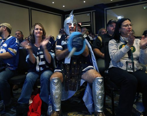 CFL/ Toronto Argo fans Michael Vanchu and Nuala Findlay( from Toronto) at left listen to CFL Commissioner Jeffrey L. Orridge speak about the State of the League. The room was full of fans attending the event at the Fairmont Winnipeg Friday and they had a chance to have their picture taken with the Grey Cup. Wayne Glowacki / Winnipeg Free Press Nov. 27    2015