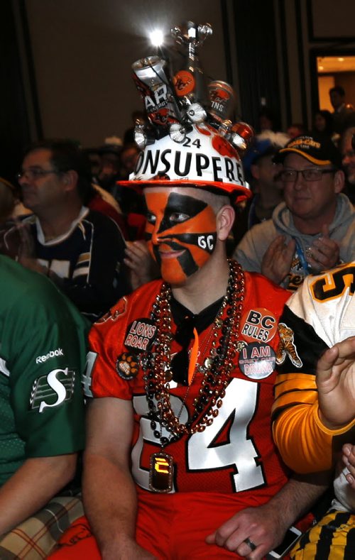 CFL/ BC Lions fan Kyle Dunn listens to CFL Commissioner Jeffrey L. Orridge speak about  State of the League. The room was full of fans attending the event at the Fairmont Winnipeg Friday and had a chance to have their picture taken with the Grey Cup. Wayne Glowacki / Winnipeg Free Press Nov. 27    2015