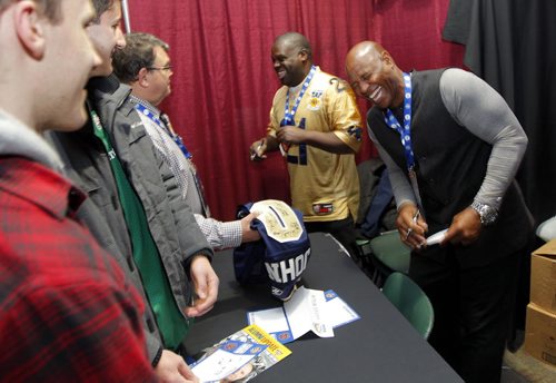 CFL ALUMNI LUNCH AND HALL OF FAME - Gerald Wilcox and James Wild West (R) sign autographs after the Alumni Lunch. BORIS MINKEVICH / WINNIPEG FREE PRESS  NOV 27, 2015