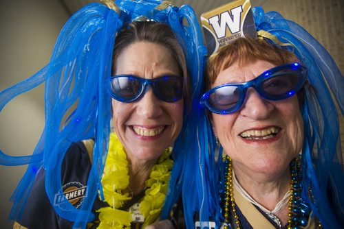 Sylvia (left) and Barbara Main, mother and daughter duo, celebrate Grey cup at the RBC Convention Centre in Winnipeg on Friday, Nov. 27, 2015.   (Mikaela MacKenzie/Winnipeg Free Press)