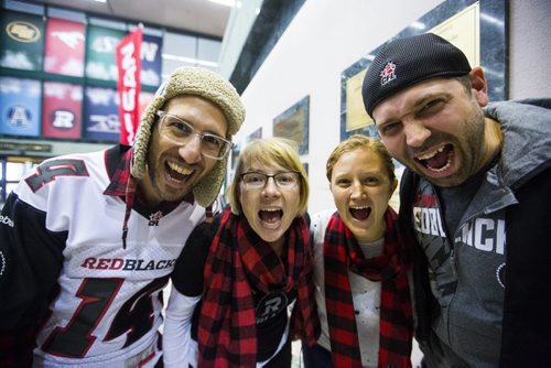 Ottawa Redblack fans Brian Kahn (left), Michelle Lang, Cynthia Thomson, and Nathan Lang celebrate Grey Cup at the RBC Convention Centre in Winnipeg on Friday, Nov. 27, 2015.   (Mikaela MacKenzie/Winnipeg Free Press)