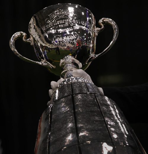 Canadian Football Hall Of Fame Jeff McWhinney displays the Grey Cup to fans at the Macdon Fan Experience & Family Zone, Health & Recplex University of Winnipeg -See storyNov 27, 2015   (JOE BRYKSA / WINNIPEG FREE PRESS)