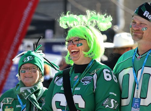 Chris Rodman of Regina takes part in the fanfare activities with her husband, Russ and friend Judy Madsen at the U of W's street festival during the 103rd Grey Cup Festival activities  Saturday.  Standup Nov 28, 2015 Ruth Bonneville / Winnipeg Free Press