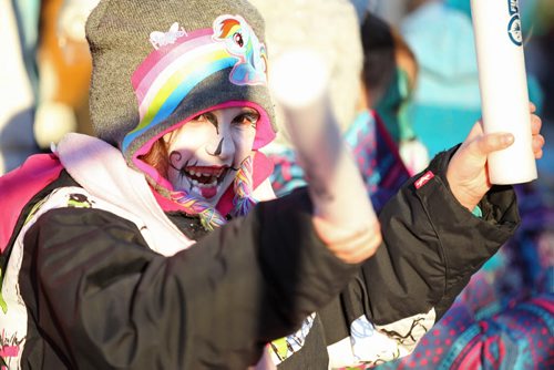 Seven-year-old Izzabella Raine waits with her friends and family on Portage Ave. for the Santa Claus Parade to start after getting her face painted at the Macdon Family zone at the U of W during the day.   Nov 28, 2015 Ruth Bonneville / Winnipeg Free Press