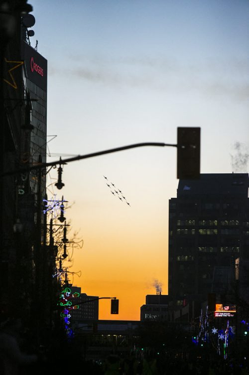 Snowbirds do a fly-by at the Santa Claus/Grey Cup parade on Portage Avenue in Winnipeg on Saturday, Nov. 28, 2015.   (Mikaela MacKenzie/Winnipeg Free Press)