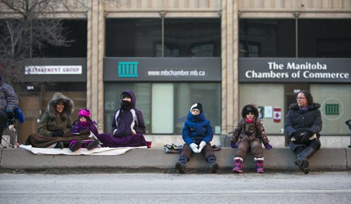 Families wait for the Santa Claus/Grey Cup parade to start on Portage Avenue in Winnipeg on Saturday, Nov. 28, 2015.   (Mikaela MacKenzie/Winnipeg Free Press)