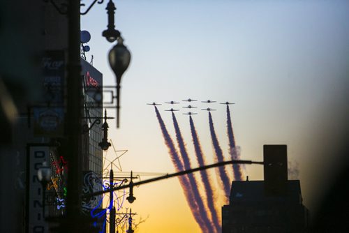 The Snowbirds do a fly-by at the Santa Claus/Grey Cup parade on Portage Avenue in Winnipeg on Saturday, Nov. 28, 2015.   (Mikaela MacKenzie/Winnipeg Free Press)