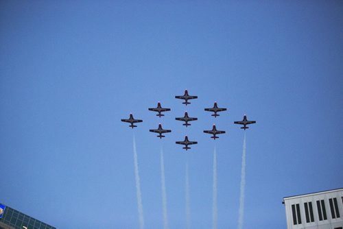 The Snowbirds do a fly-by at the Santa Claus/Grey Cup parade on Portage Avenue in Winnipeg on Saturday, Nov. 28, 2015.   (Mikaela MacKenzie/Winnipeg Free Press)