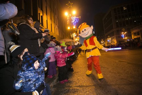 Festivities take place at the Santa Claus/Grey Cup parade on Portage Avenue in Winnipeg on Saturday, Nov. 28, 2015.   (Mikaela MacKenzie/Winnipeg Free Press)