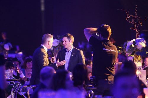 Mayor Brian Bowman chats with MC Gerry Dee at the Grey Cup gala dinner in Winnipeg on Saturday, Nov. 28, 2015. (Mikaela MacKenzie/Winnipeg Free Press)