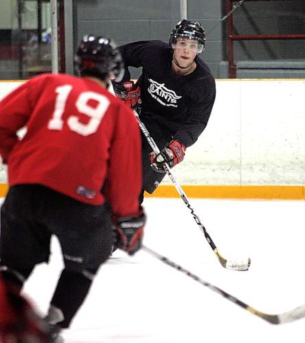 BORIS MINKEVICH / WINNIPEG FREE PRESS  080123 Saints player Trent King (right in black) at practice. Photo taken at Dakota C.C.