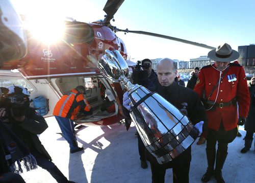 After the fan parade Sunday to The Forks, Jeff McWhinney places the Grey Cup in its case before it is loaded on to the STARS air ambulance and delivered to Investors Group Field  for  the Grey Cup Game. Geoff Kirbyson story  Wayne Glowacki / Winnipeg Free Press Nov. 27    2015