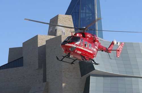 After the fan parade Sunday to The Forks, the STARS air ambulance picked up the Grey Cup by the Canadian Museum for Human Rights and delivered it to Investors Group Field  for  the Grey Cup Game. Wayne Glowacki / Winnipeg Free Press Nov. 29   2015