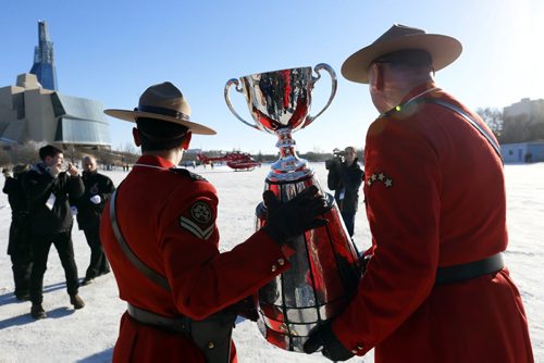 After the fan parade Sunday to The Forks, the Grey Cup is carried to the STARS air ambulance and delivered to Investors Group Field for the Grey Cup Game. Geoff Kirbyson story Wayne Glowacki / Winnipeg Free Press Nov. 29   2015