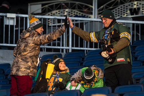 Fans get into the spirit as they find their seats before the Grey Cup championship game against the Edmonton Eskimos and the Ottawa Redblacks in Winnipeg, November 29, 2015. 151129 - Sunday, November 29, 2015 -  MIKE DEAL / WINNIPEG FREE PRESS