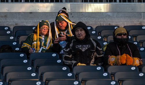 Fans checking their phones before the Grey Cup championship game against the Edmonton Eskimos and the Ottawa Redblacks in Winnipeg, November 29, 2015. 151129 - Sunday, November 29, 2015 -  MIKE DEAL / WINNIPEG FREE PRESS