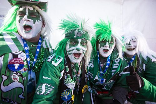 Tony Dagenias (left), Trevor Stoddard, Stacey Burden, and Ali Martin cheer before the Grey Cup at Investors Group Field in Winnipeg on Sunday, Nov. 29, 2015.   (Mikaela MacKenzie/Winnipeg Free Press)