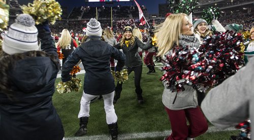 Cheerleaders from all the CFL teams take to the field during the pre-game show at the Grey Cup championship game against the Edmonton Eskimos and the Ottawa Redblacks in Winnipeg, November 29, 2015. 151129 - Sunday, November 29, 2015 -  MIKE DEAL / WINNIPEG FREE PRESS