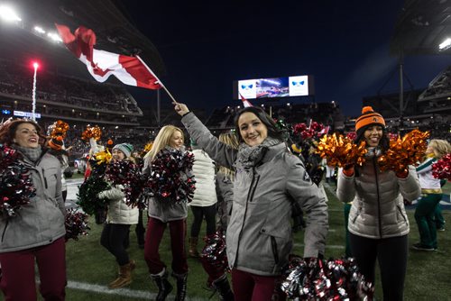 Cheerleaders from all the CFL teams take to the field during the pre-game show at the Grey Cup championship game against the Edmonton Eskimos and the Ottawa Redblacks in Winnipeg, November 29, 2015. 151129 - Sunday, November 29, 2015 -  MIKE DEAL / WINNIPEG FREE PRESS