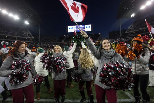 Cheerleaders from all the CFL teams take to the field during the pre-game show at the Grey Cup championship game against the Edmonton Eskimos and the Ottawa Redblacks in Winnipeg, November 29, 2015. 151129 - Sunday, November 29, 2015 -  MIKE DEAL / WINNIPEG FREE PRESS
