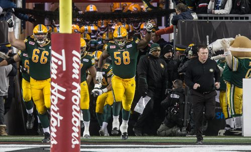 The Edmonton Eskimos enter the field during the pre-game show at the Grey Cup championship game against the Edmonton Eskimos and the Ottawa Redblacks in Winnipeg, November 29, 2015. 151129 - Sunday, November 29, 2015 -  MIKE DEAL / WINNIPEG FREE PRESS