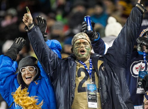 Fans react in the second quater of the Grey Cup championship game against the Edmonton Eskimos and the Ottawa Redblacks in Winnipeg, November 29, 2015. 151129 - Sunday, November 29, 2015 -  MIKE DEAL / WINNIPEG FREE PRESS