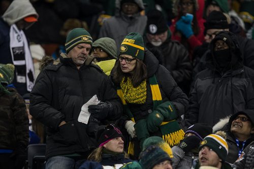 Fans check their 50-50 tickets during the 4th quarter of the Grey Cup championship game between the Edmonton Eskimos and the Ottawa Redblacks in Winnipeg, November 29, 2015. 151129 - Sunday, November 29, 2015 -  MIKE DEAL / WINNIPEG FREE PRESS