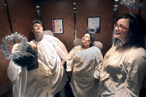 Misericordia Hospital will tomorrow attempt to break Guinness World Record: Largest Gathering of Angels- Celebrating 20 years of Angel Squad- The official counting will be completed at Mulvey School playgrounds - Misericordia employees  L to R  Mary Ann King, Mike Tomchuk, Mirna Alberto and  Kristyn Dunn, ,  in elevator heading to rooftop of hospital-  See storyNov 30, 2015   (JOE BRYKSA / WINNIPEG FREE PRESS)