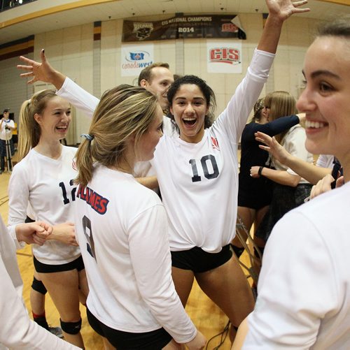 November 30, 2015 - 151130  - Laura Hill (10) and the St. Mary's Flames  celebrate their win over the Lord Selkirk Royals in the Manitoba High Schools Athletic Association (MHSAA) volleyball final at University of Manitoba Monday, November 30, 2015. John Woods / Winnipeg Free Press