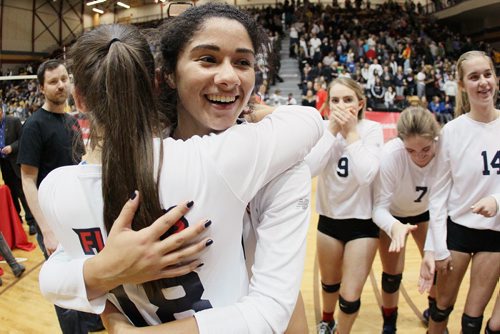 November 30, 2015 - 151130  - Laura Hill (10) and Jenna Cross (18) of the St. Mary's Flames embrace as they celebrate their win over the Lord Selkirk Royals in the Manitoba High Schools Athletic Association (MHSAA) volleyball final at University of Manitoba Monday, November 30, 2015. John Woods / Winnipeg Free Press