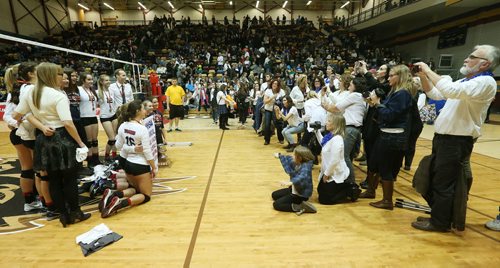 November 30, 2015 - 151130  -  Parents photograph St. Mary's Flames after they defeated the Lord Selkirk Royals in the Manitoba High Schools Athletic Association (MHSAA) volleyball final at University of Manitoba Monday, November 30, 2015. John Woods / Winnipeg Free Press