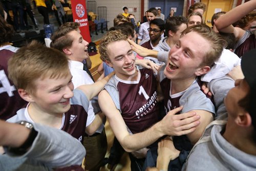 November 30, 2015 - 151130  -  Matthew Stasiuk (1)(c) and Benjamin Hooker (6)(R) of the St Paul's Crusaders celebrate with fans and players after defeating the Miles MacDonell Buckeyes in the Manitoba High Schools Athletic Association (MHSAA) volleyball final at University of Manitoba Monday, November 30, 2015. John Woods / Winnipeg Free Press