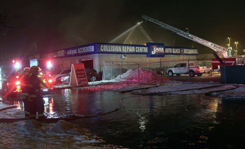 Firefighters on scene of fire at the JMax Auto Service at Lorette and Pembina near 645 am Tuesday- The fire started near 1130 PM Monday night- crews have been battling since- See storyNov 30, 2015   (JOE BRYKSA / WINNIPEG FREE PRESS)