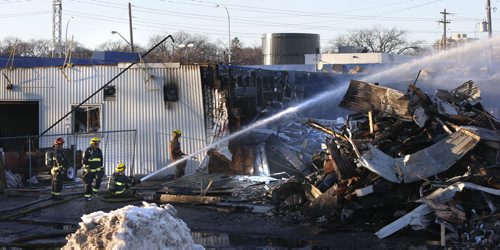 Winnipeg Fire Fighters were still on the scene late in the day Tuesday working on a fire at the JMax Auto Centre on Pembina Hwy. that broke out Monday night. Many vehicles inside the shop were damaged. Wayne Glowacki / Winnipeg Free Press Dec.1 2015