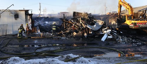 Winnipeg Fire Fighters were still on the scene late in the day Tuesday working on a fire at the JMax Auto Centre on Pembina Hwy. that broke out Monday night. Many vehicles inside the shop were damaged. Wayne Glowacki / Winnipeg Free Press Dec.1 2015