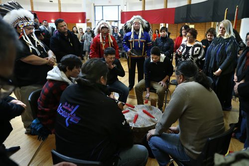 Standing a right,  Family Services Minister Kerri Irvin-Ross listens to the Red Bear drum group after she announced changes to the Child and Family Services Act that will greatly increase community involvement in caring for children through customary care.The event was held at Thunderbird House Wednesday.  Mary Agnes Welch story Wayne Glowacki / Winnipeg Free Press Dec. 2  2015