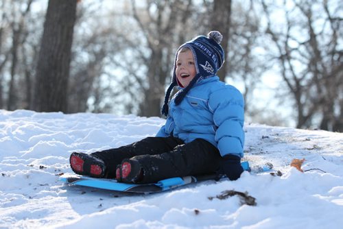 Four-year-old Ethan Kresky goes sledding at Kildonan Park with mom, (Michelle), at Kildonan Park on another warm and sunny winter day.    Standup photo Dec 02, 2015 Ruth Bonneville / Winnipeg Free Press