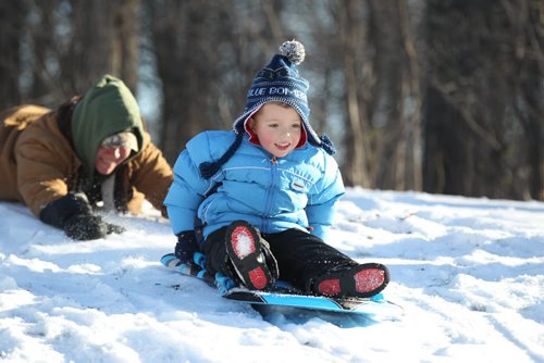 Four-year-old Ethan Kresky goes sledding at Kildonan Park with mom, (Michelle), at Kildonan Park on another warm and sunny winter day.    Standup photo Dec 02, 2015 Ruth Bonneville / Winnipeg Free Press