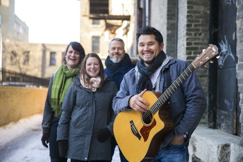 Don Amero and backup singers pose in an alley after singing for a holiday Exchange Session on Wednesday, Dec. 2, 2015.   Mikaela MacKenzie / Winnipeg Free Press