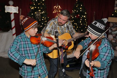 WINNIPEG, MB - The Forks Market Holiday Bazaar. The Forks Market is kicking off the holiday season with a fun shopping event for all. The Wrigley family band called Double the Trouble. L-R Aidan, Rob, and Luc. The kids are 11 year old twins. BORIS MINKEVICH / WINNIPEG FREE PRESS  DEC 3, 2015