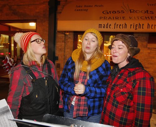 WINNIPEG, MB - The Forks Market Holiday Bazaar. The Forks Market is kicking off the holiday season with a fun shopping event for all. Outside The Timber Trio singers do some carolling. L-R Andraea Sartison, Jacquline Harding, and Claire Therese. BORIS MINKEVICH / WINNIPEG FREE PRESS  DEC 3, 2015
