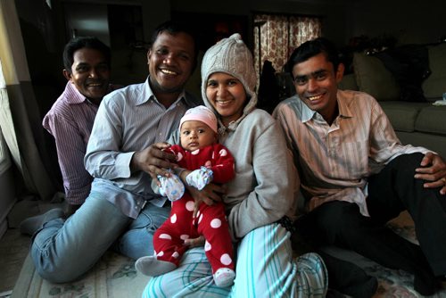 Rohingya Muslim refugees from Myanmar where they were persecuted by Buddhists and had no rights, now are settled in Wpg. Names from left: Mohammed Tayab, Omar Sarduk (dad of baby), Khin Khin Tay (mom), Thoudada Nay (baby, 3 months) and Hafzur Rahaman. See Carol Sanders story. Dec 04, 2015 Ruth Bonneville / Winnipeg Free Press