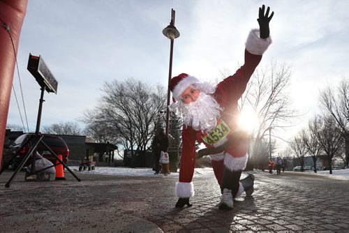 December 5, 2015 - 151205  -  Santa, a.k.a. Scott McCullouch attempts to cross the finish line in the Salvation Army Santa Shuffle Saturday, December 5, 2015. John Woods / Winnipeg Free Press