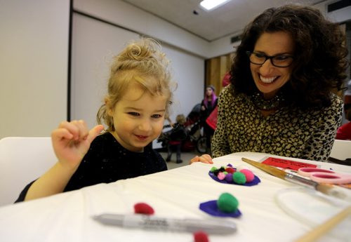 Lyla Nedelec, 3, and her grandmother, Hennie Corrin, making holiday decorations at the Winnipeg Art Gallery, Saturday, December 5, 2015. (TREVOR HAGAN/WINNIPEG FREE PRESS)