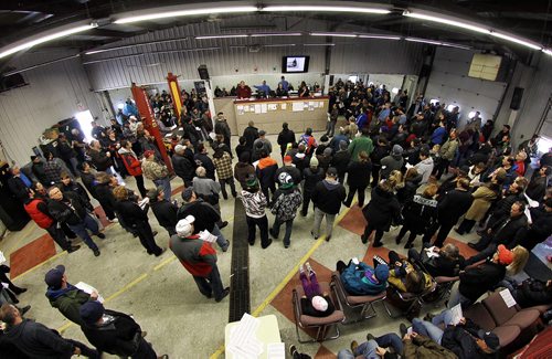 A packed house at the Winnipeg Police Service's unclaimed goods auction Sunday afternoon at Associated Auto Auction on Roblin Blvd.  151206 December 06, 2015 Mike Deal / Winnipeg Free Press