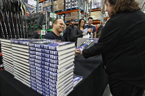 Hockey legend Tie Domi at the Costco on McGillivray Boulevard Sunday afternoon joking with fans while signing copies of his memoirs Shiftwork. 151206 December 06, 2015 Mike Deal / Winnipeg Free Press